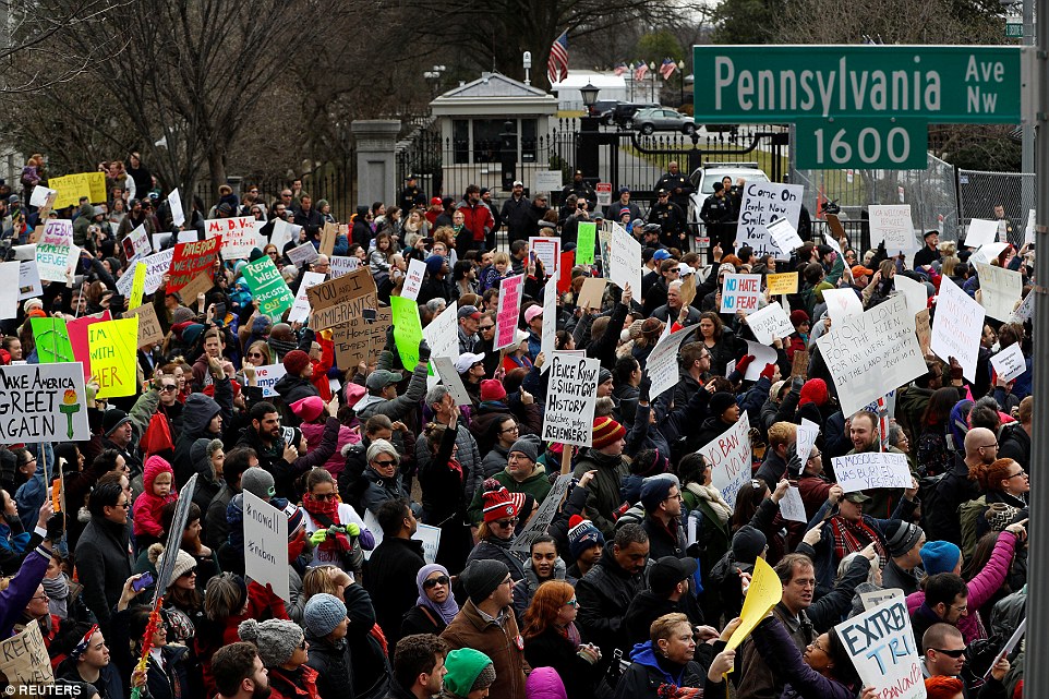 Activists gather outside the White House to protest President Donald Trump's executive actions on immigration