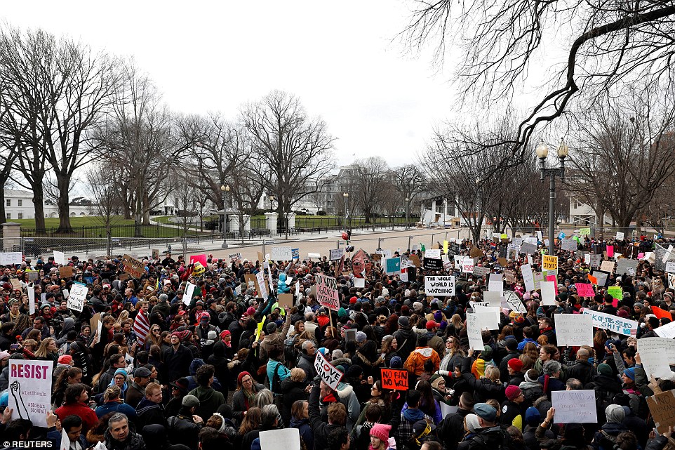 A crowd of activists also gathered outside the White House on Sunday as part of nationwide protests against Trump's ban