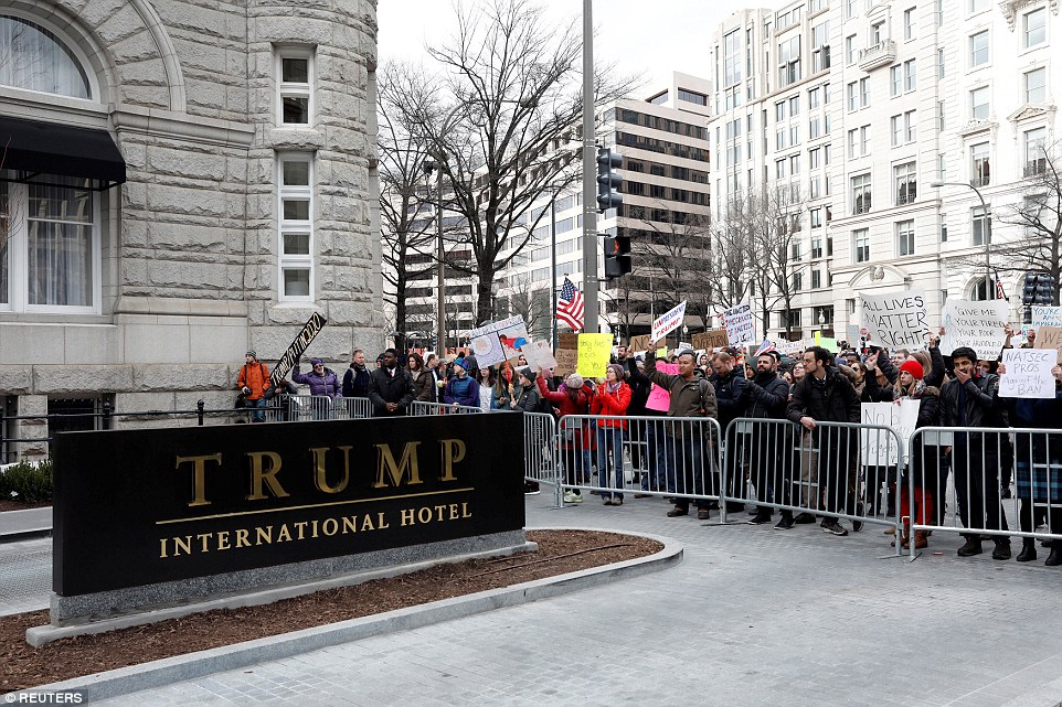 Activists gathered outside the Trump International Hotel in Washington DC on Sunday to protest Trump's executive actions