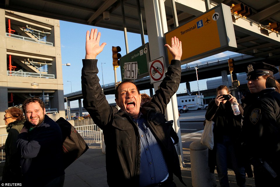 Zabihollah Zarepisheh of Iran is pictured celebrating after being released from JFK's Terminal 4 for more than 30 hours