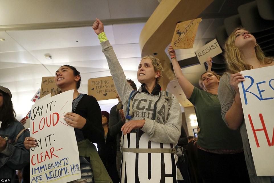 The group of protesters gathered at Los Angeles International Airport on Sunday are seen on the second day of demonstrations