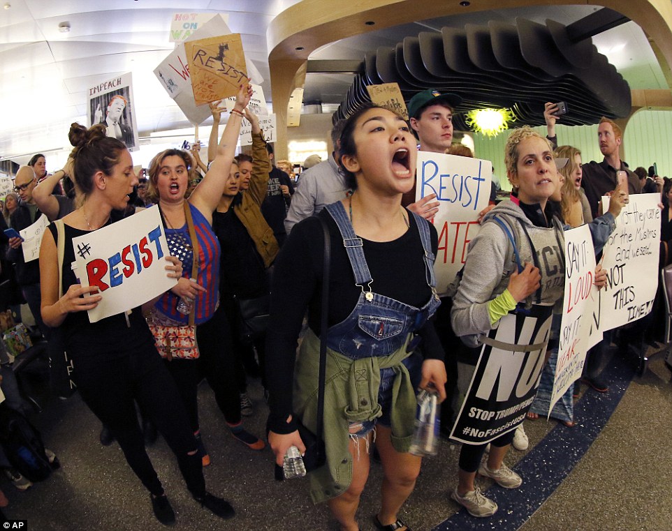 Demonstrators chanted inside Tom Bradley International Terminal at Los Angeles International Airport, where protests continued on Sunday