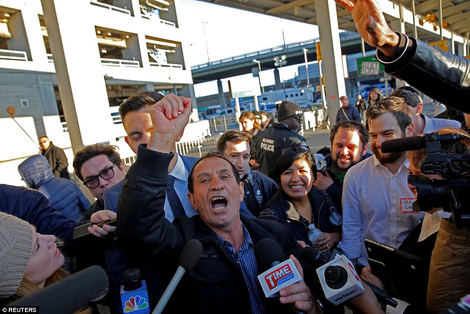 Zabihollah Zarepisheh of Iran celebrated after being released from JFK's Terminal 4 for after more than 30 hours' detention