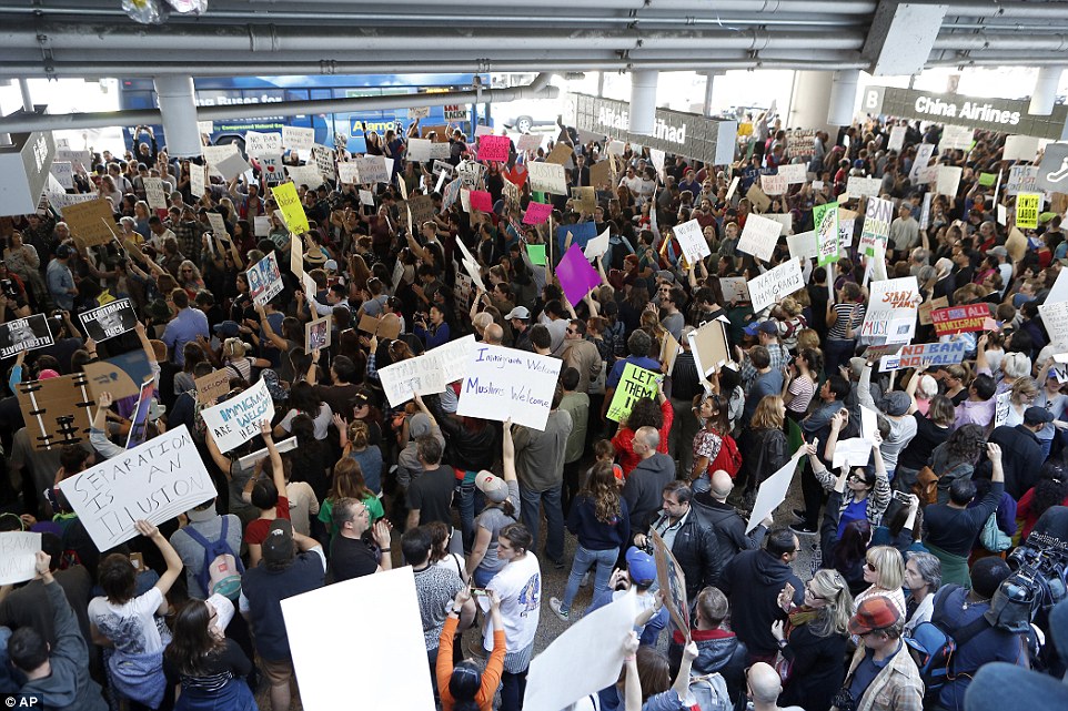 Hundreds of people demonstrated in the lower roadway outside Tom Bradley International Terminal on Sunday at LAX