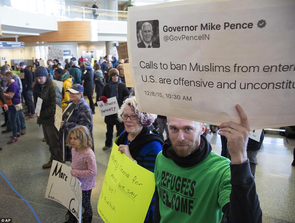 More than 600 people gathered at Idaho's Boise Airport on Sunday to protest Trump's travel bans. One protester highlighted a 2015 tweet by Vice-President Mike Pence saying banning Muslims from the US is 'offensive and unconstitutional'
