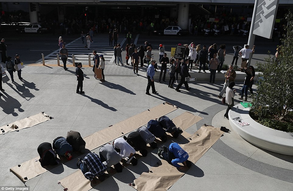 Muslim men prayed Sunday at Los Angeles International Airport during a demonstration against Trump's immigration ban