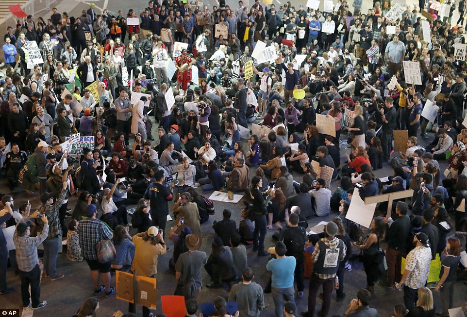 Hundreds of demonstrators gathered on the roadway during a protest against Trump's executive order at Los Angeles International Airport