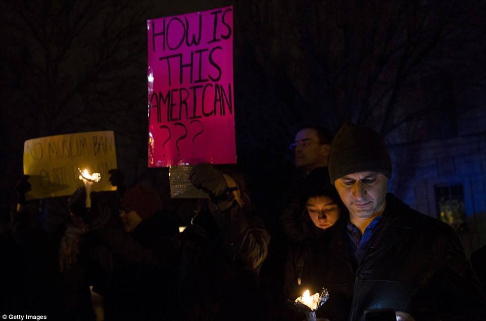 Demonstrators gathered during a candlelit vigil near the Naval Observatory on Sunday night in Washington, DC