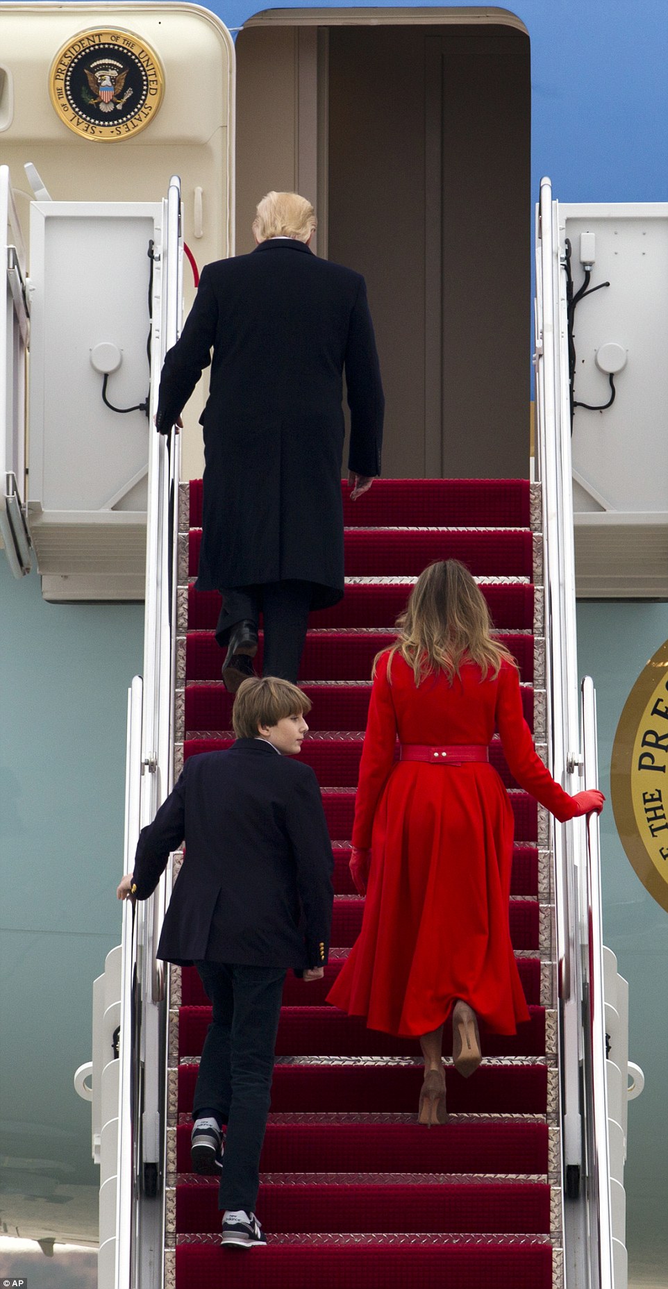 Barron wore a pair of New Balance sneakers with his blazer and slacks