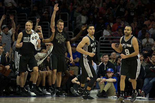 PHILADELPHIA, PA - FEBRUARY 8: Manu Ginobili #20, Patty Mills #8, David Lee #10 and Tony Parker #9 of the San Antonio Spurs react after a made basket by Danny Green #14 in the fourth quarter against the Philadelphia 76ers at the Wells Fargo Center on Febr