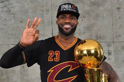 OAKLAND, CA - JUNE 19: LeBron James #23 of the Cleveland Cavaliers poses for a portrait with the World Championship Trophy after winning the NBA Championship against the Golden State Warriors during the 2016 NBA Finals Game Seven on June 19, 2016 at ORAC