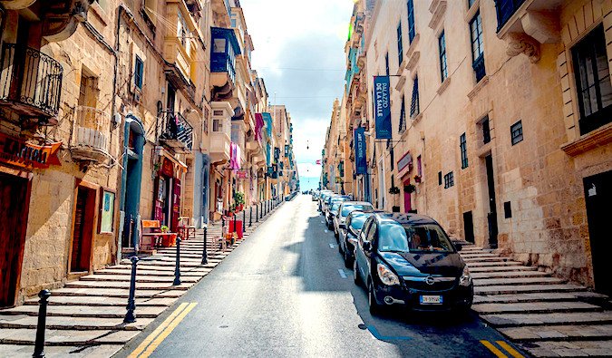 cars on a colorful street in malta, photo by Tobias Scheck (flickr: @uncloned)