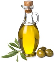 Olive Oil in a Glass Bottle and Three Green Olives and Leaves