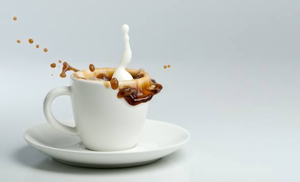 Milk Splashing into a Coffee Cup