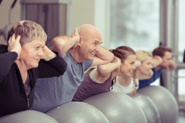 Senior Man in a Fitness Class with Younger People